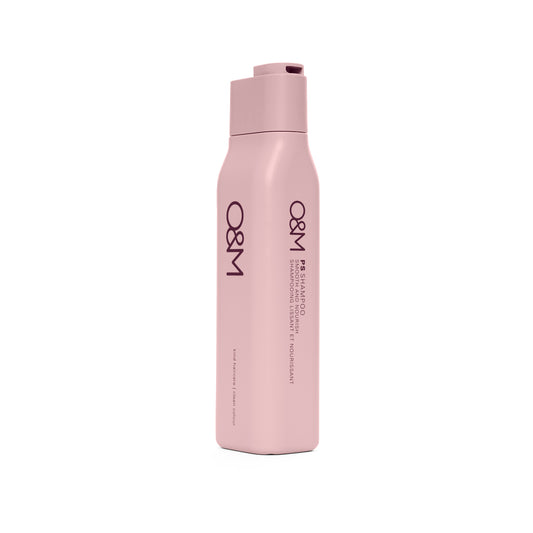 Pink shampoo bottle with 'O&M' branding on a white background